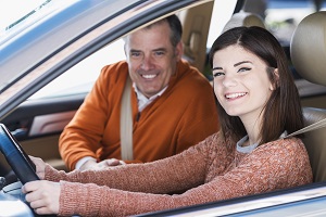 Girl in car with dad